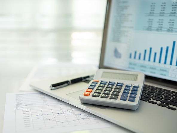 Calculator, paper, pen and laptop